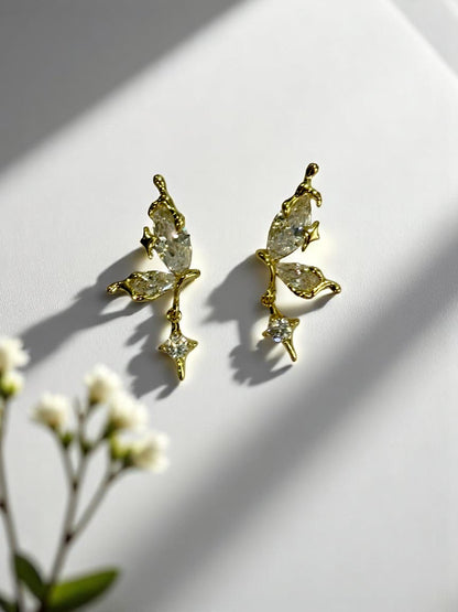 GOLDEN HANGING DIAMOND BUTTERFLY AXEL EARRINGS
