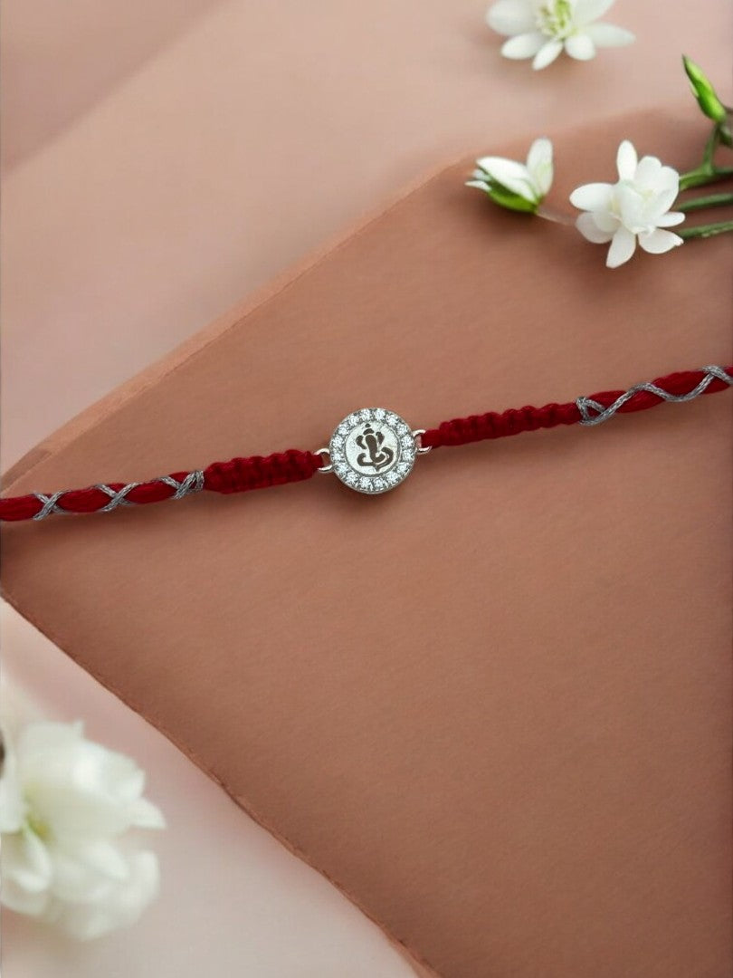 DIAMOND GANESHA TARINI PURE SILVER RAKHI