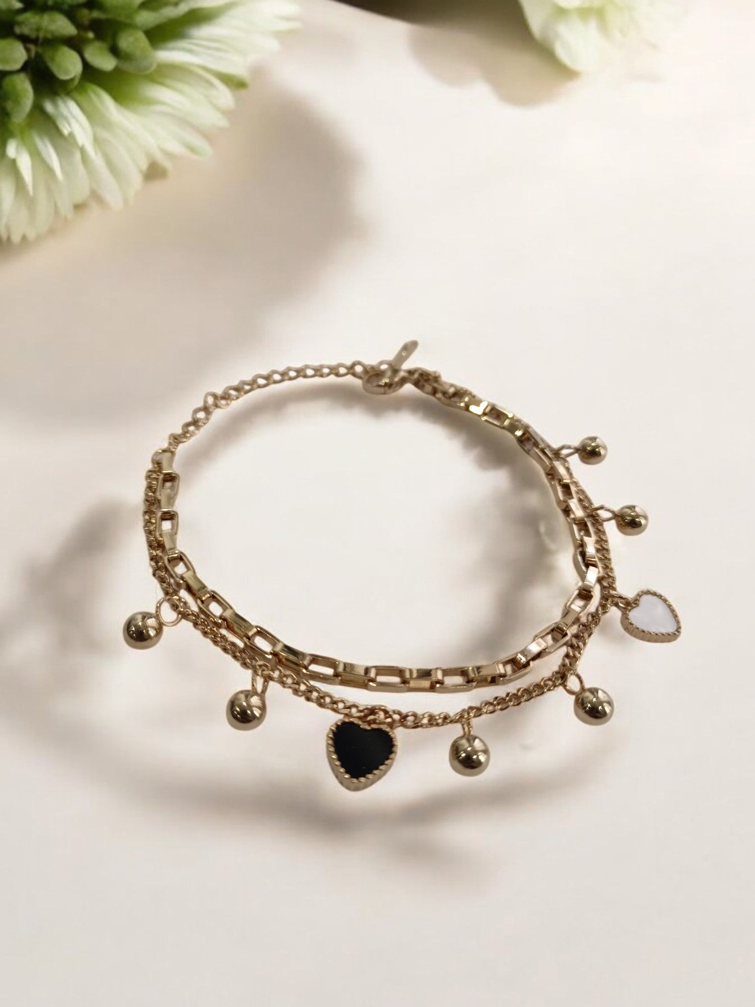 GOLDEN CHAIN WITH BLACK AND WHITE HEART AND PEARLS