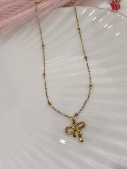 GOLDEN CHAIN WITH MINI BALLS AND BOW