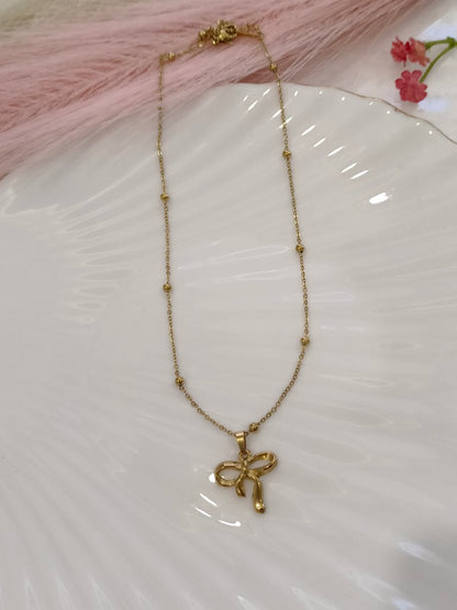 GOLDEN CHAIN WITH MINI BALLS AND BOW