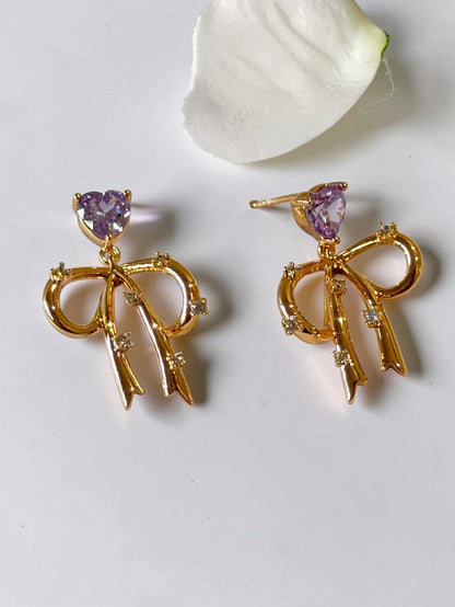 PURPLE HEART BOW VERIE EARRINGS