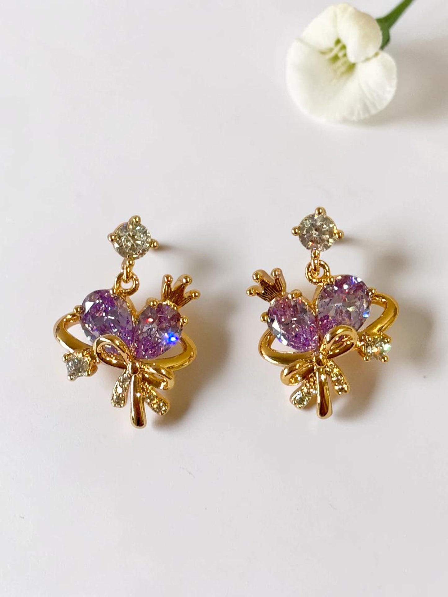 PURPLE STONE BOW AARA EARRINGS
