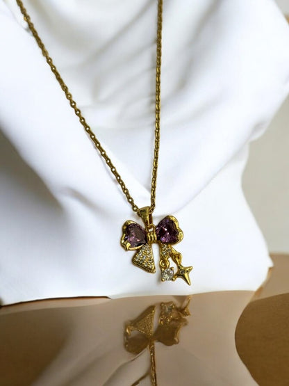 GOLDEN CHAIN WITH PURPLE DIAMOND BOW AND STAR