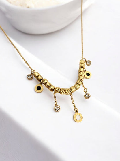 GOLDEN CHAIN WITH HANGINIG DIAMOND AND ROMAN NUMERAL CHARM