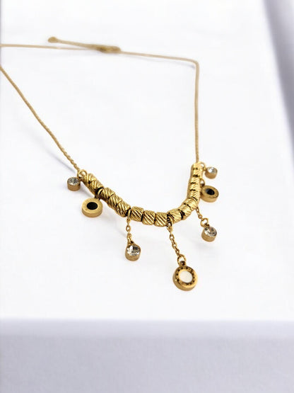 GOLDEN CHAIN WITH HANGINIG DIAMOND AND ROMAN NUMERAL CHARM