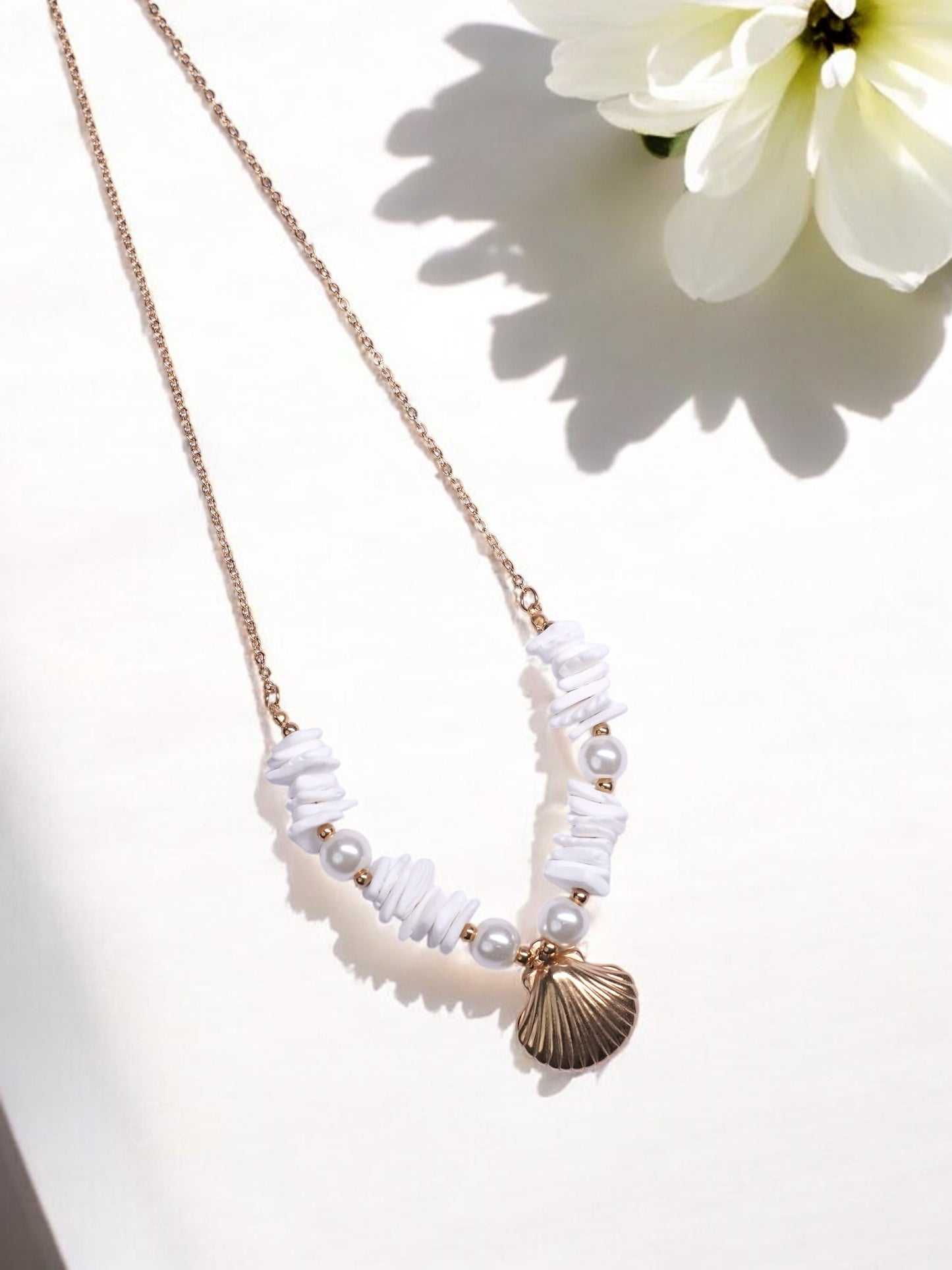 GOLDEN CHAIN WITH BEAUTIFUL PEARLS AND SHE SHELL