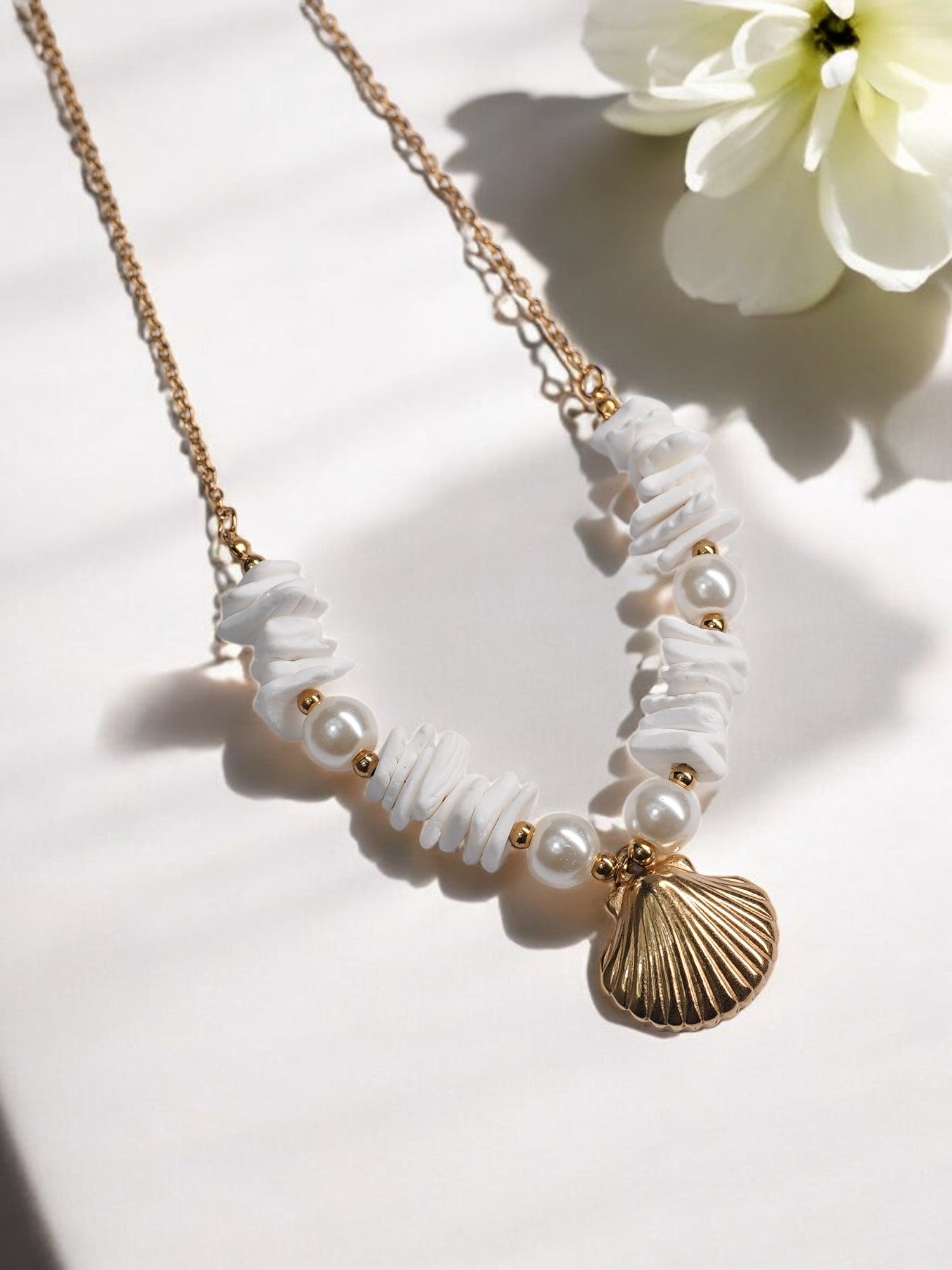 GOLDEN CHAIN WITH BEAUTIFUL PEARLS AND SHE SHELL