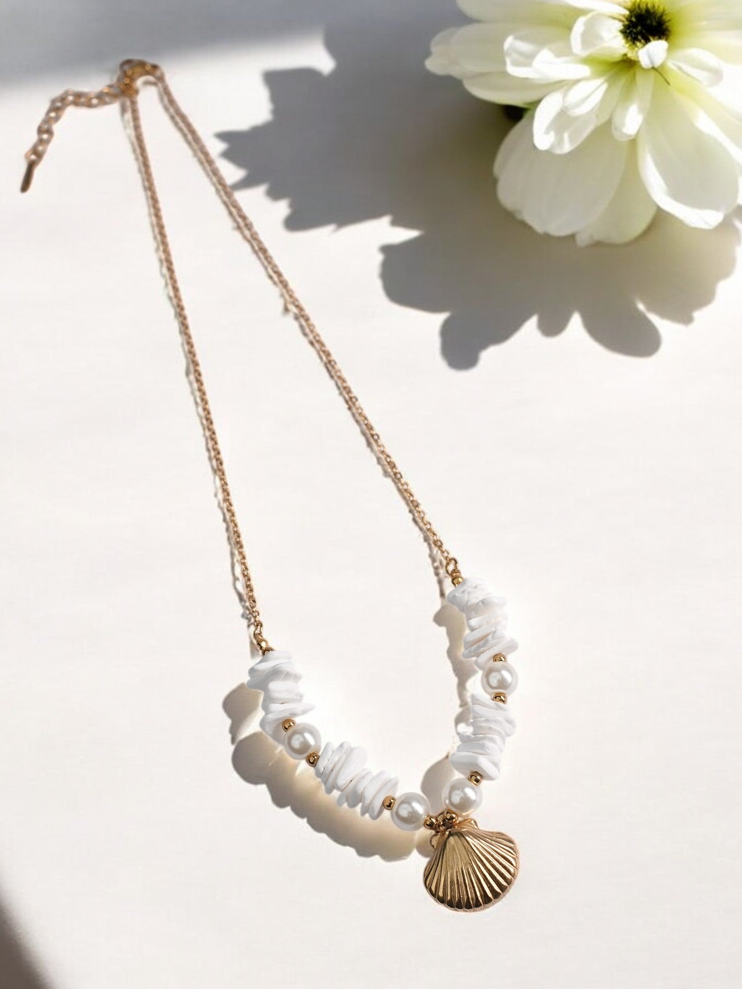 GOLDEN CHAIN WITH BEAUTIFUL PEARLS AND SHE SHELL