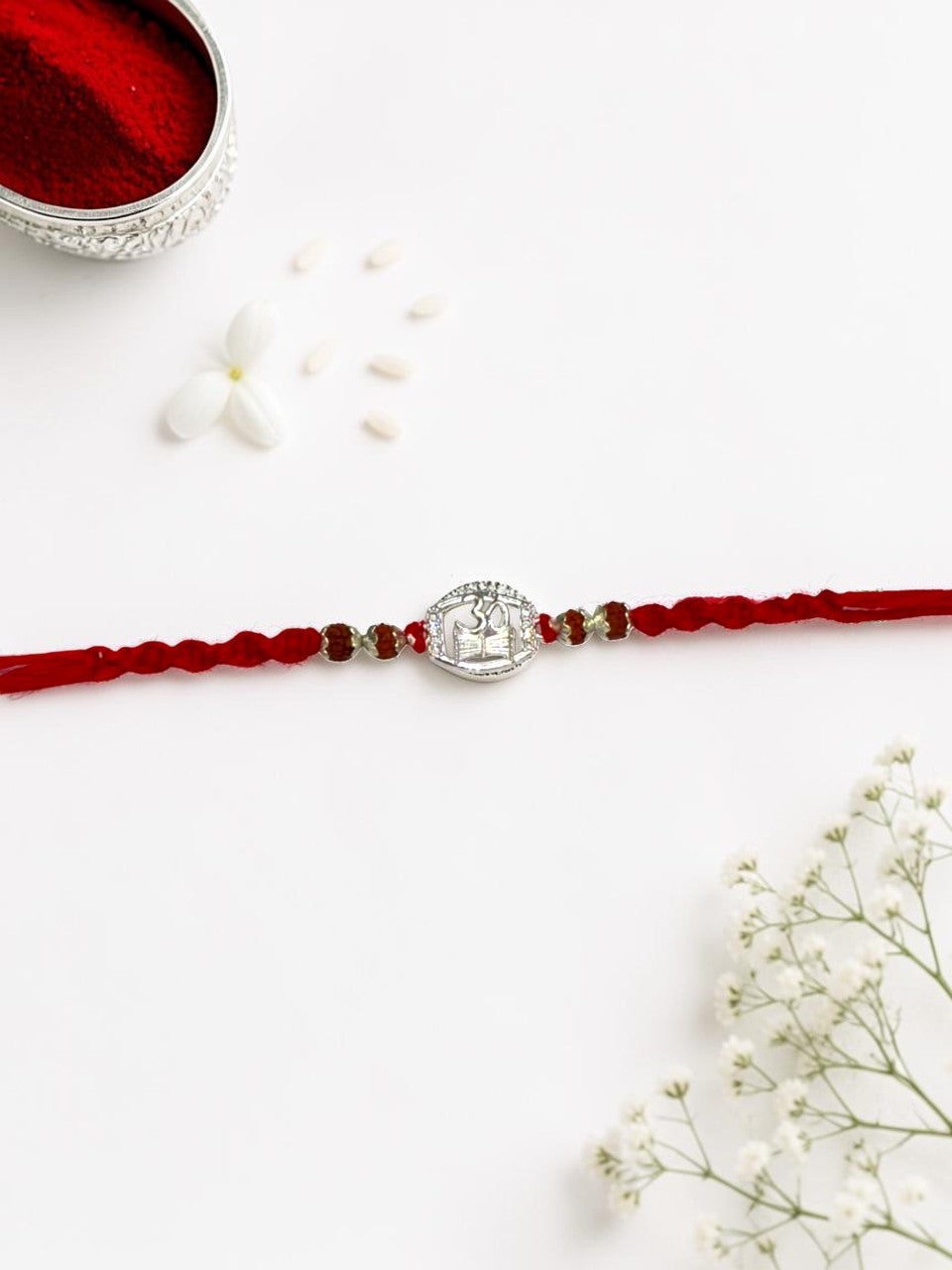 OM DAMRU DIAMOND AMORA SILVER RAKHI