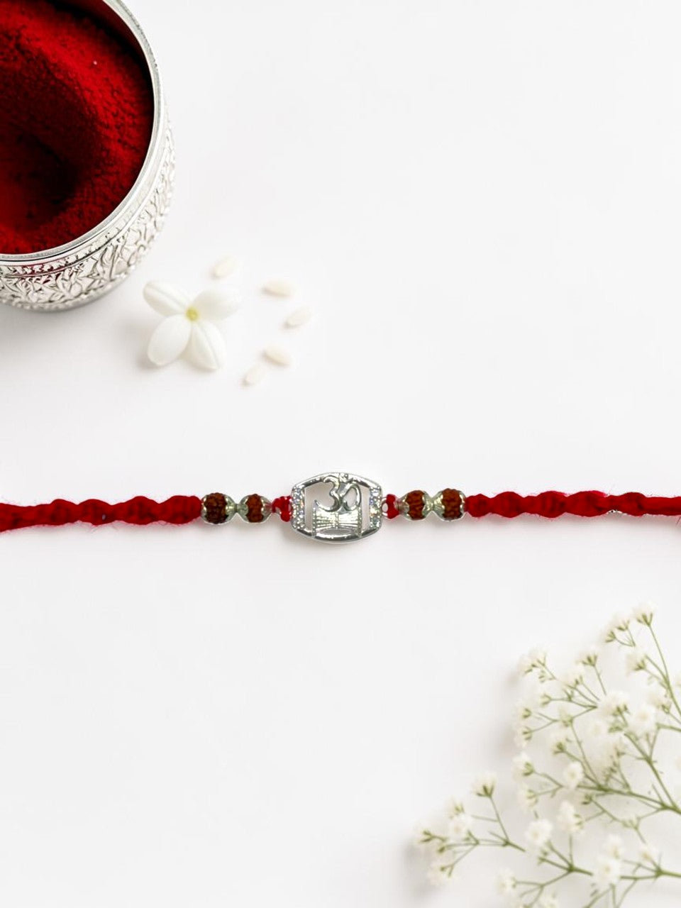 OM DAMRU DIAMOND AMORA SILVER RAKHI