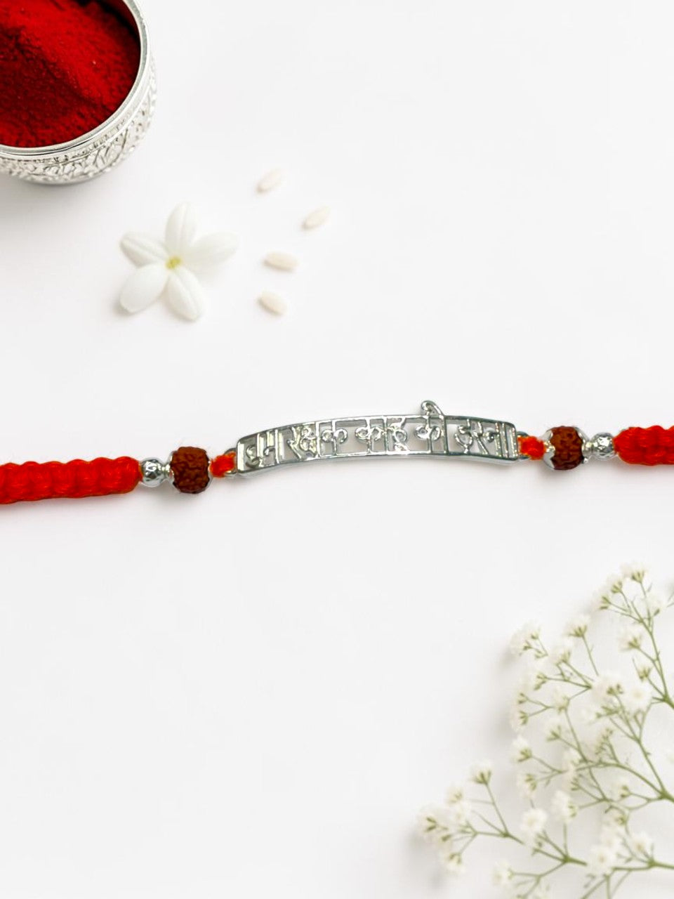 ORANGE THREAD AARADHNA SILVER RAKHI