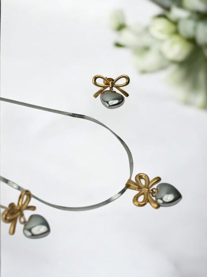 DUAL METAL GOLD AND SILVER A UNIQUE VERSATILE NECKLACE WITH BOW AND HEART